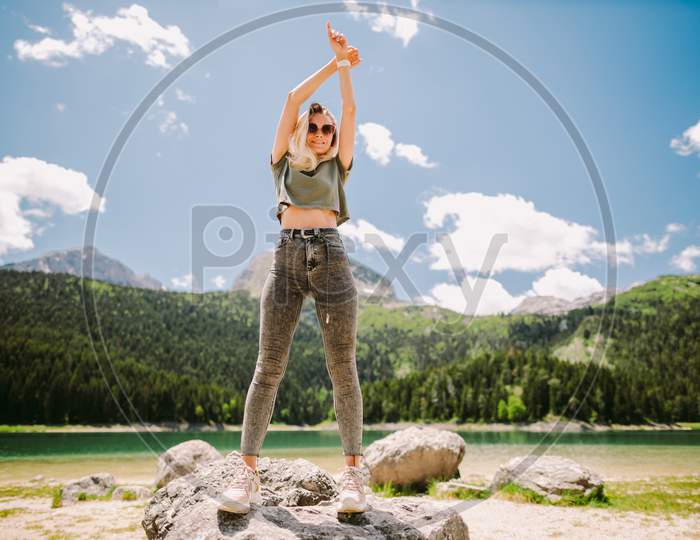 Attractive Woman Posing In Mountains