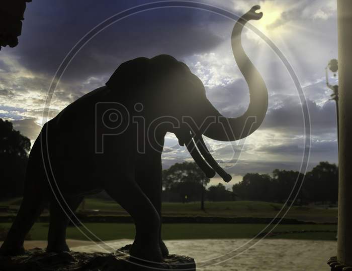 Vadodara, India - November 16, 2012: An Elephant Stone Monument Situated In The Lakshmi Vilas Palace In The State Of Gujarat Against Dramatic Sunset