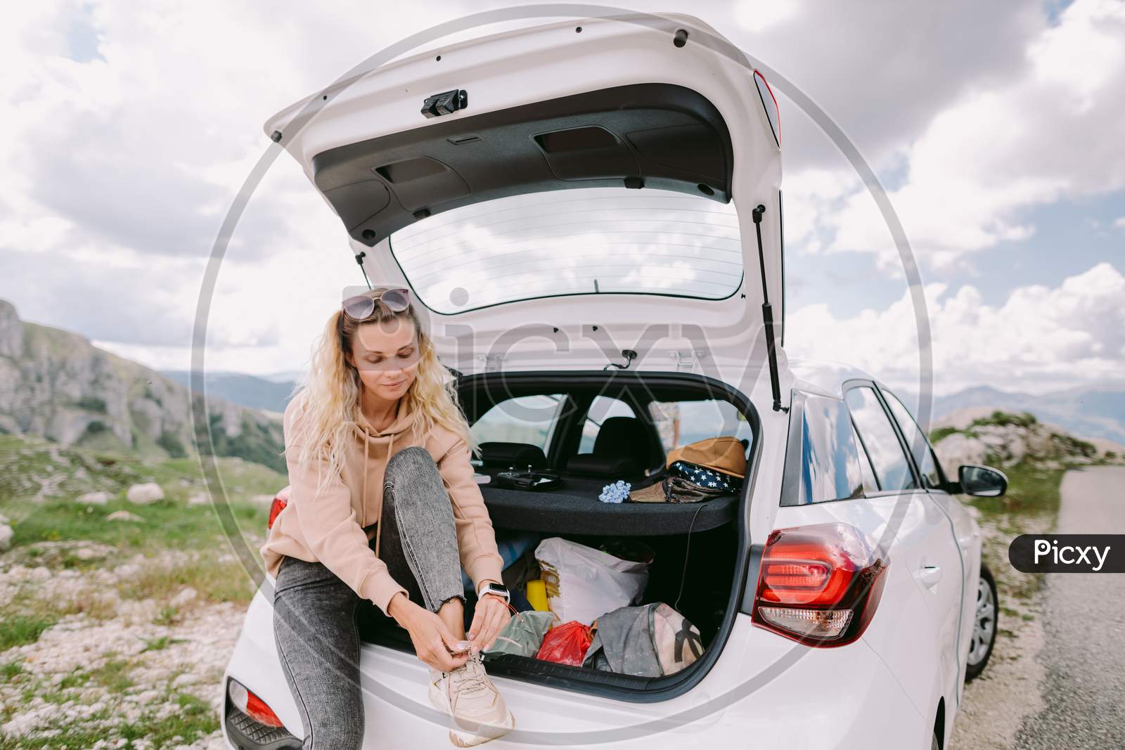 Happy Woman Travel By Car In Mountains On Vacation