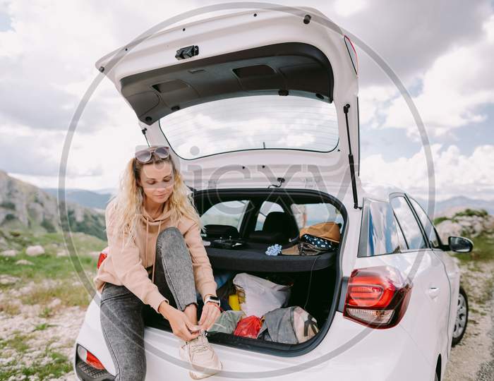 Happy Woman Travel By Car In Mountains On Vacation