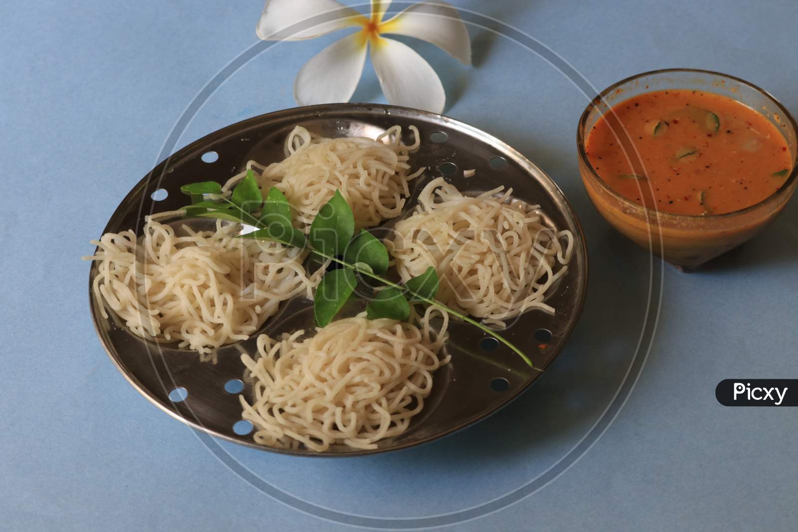 Rice Noodles in Idly Plate with Chutney Isolated with White Background