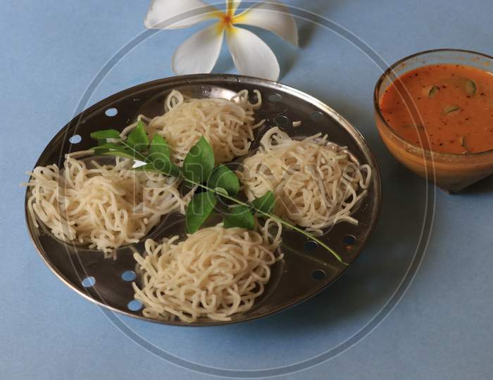 Rice Noodles in Idly Plate with Chutney Isolated with White Background