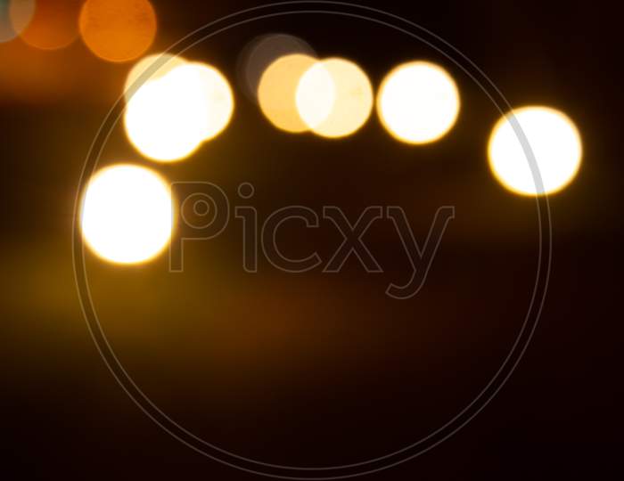 Outdoor Lights Blurred In Night Time Giving A Bokeh Effect.