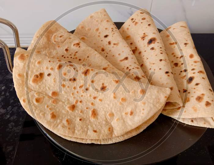 Indian Bread Or Tawa Roti Made From Whole Wheat Flour Or Refind Flour Dough