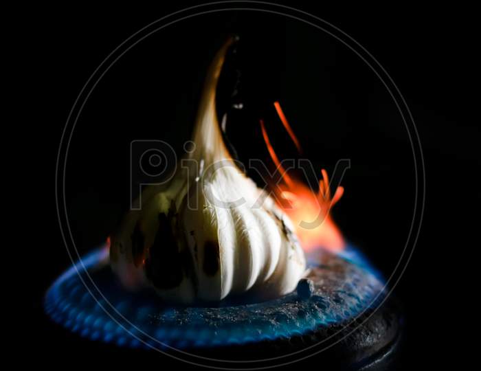 Roasting Garlic Cloves And Bulb In Fire .