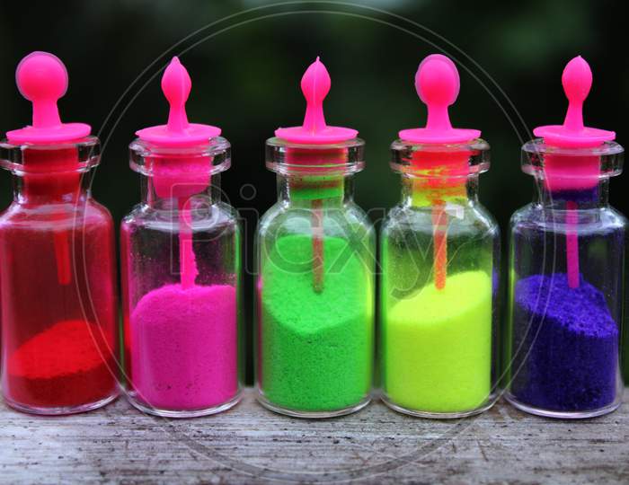 Five color power in the bottle with natural blur background
