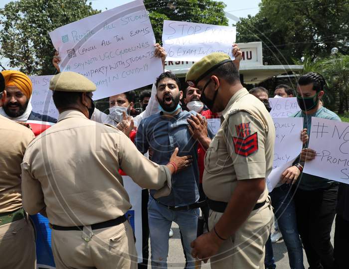 Jammu & Kashmir Apni Party members stage a protest against University Grants Commission(UGC) and the University of Jammu against their decision on mass promotion of students to their next academic years in Jammu on July 14, 2020