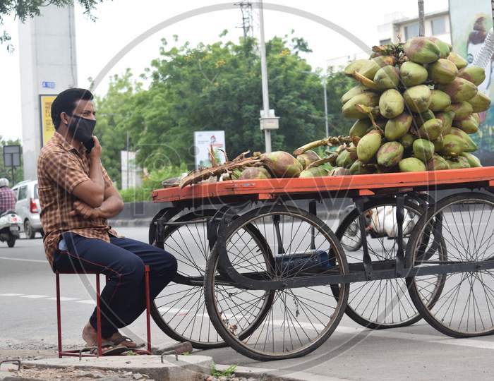 Hyderabad, Telangana, India. July-06-2020: A Man Sells Coconuts On The Road, Wearing Mask, Corona Pandemic, Street Market