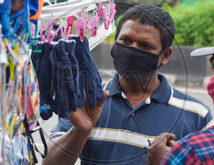 Hyderabad, Telangana, India. july-06-2020: corona virus panic concept, peoples buying face masks, to protect against corona virus, protection respirator masks at roadside, outdoor
