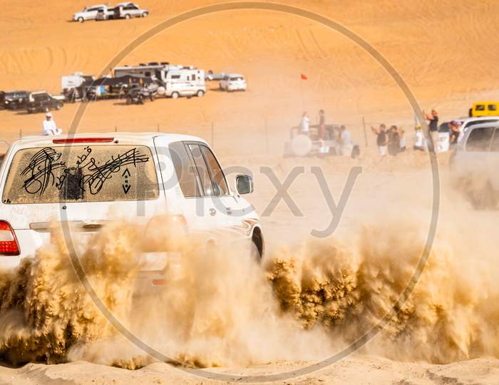 A Car Drifting At Liwa Desert In Abu Dhabi, United Arab Emirates
