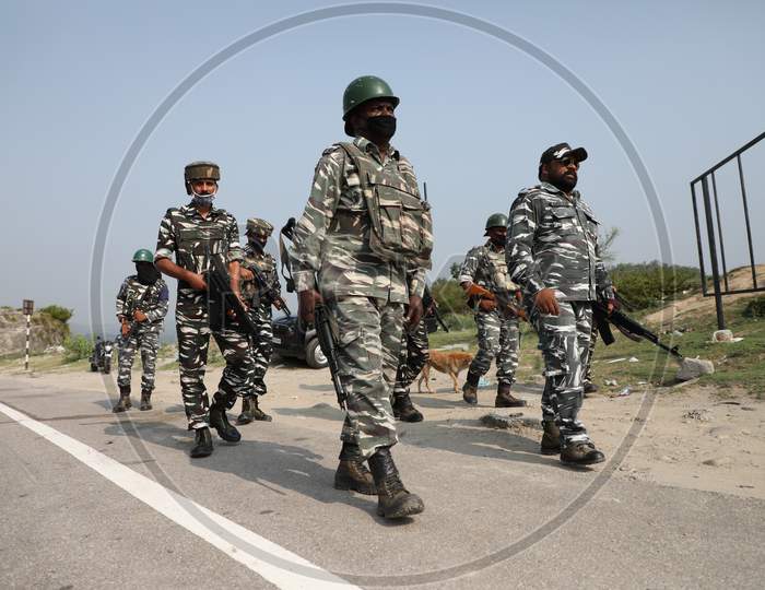 Soldiers of the Central Reserve Police Force(CRPF) patrol the Jammu and Kashmir National Highway ahead of the upcoming Amarnath yatra in Jammu on July 14, 2020