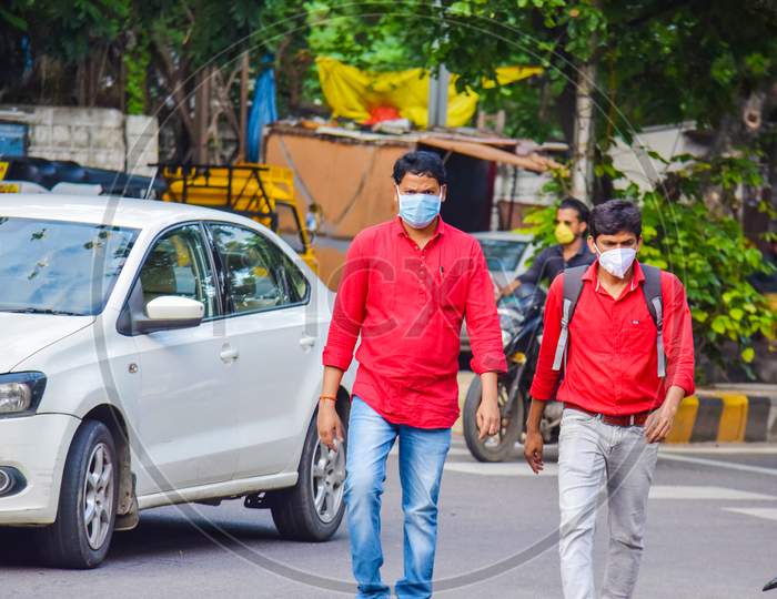 two peoples walking on the road with wearing face mask. corona virus, Covid-19, virus outbreak