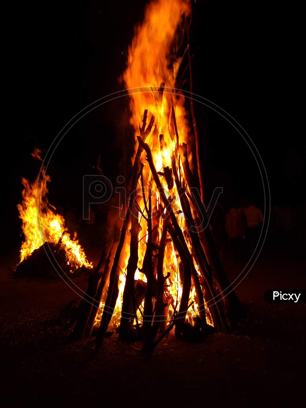 Holika dahan indian festival celebration Photograph of a giant bonfire lit for the auspicious festival of lohri or Holi or Holika Dahan