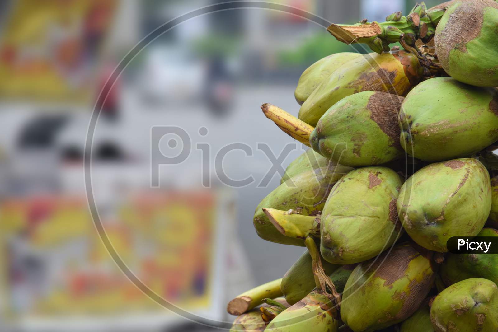pile or bunch of coconuts on the cart at road for sells in india, hyderabad