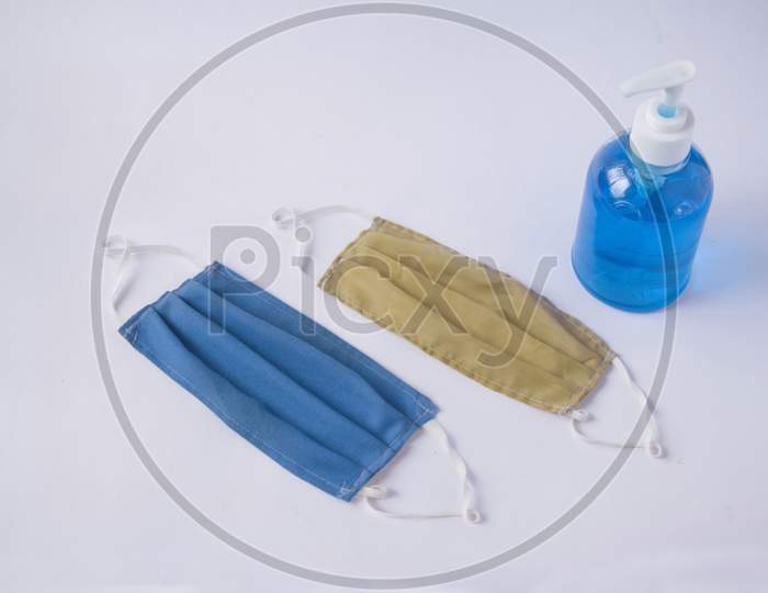 Pair of soft cotton layer mask with bottle of sanitiser