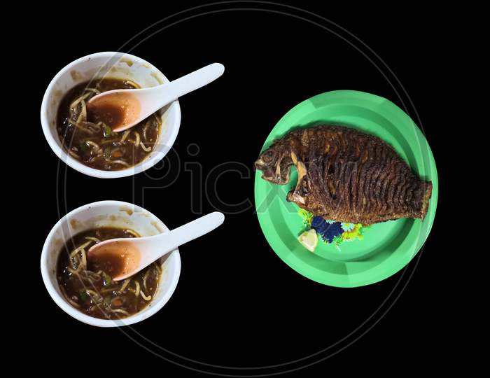Two Bowls Of Noodles And Fish Isolated On Black Background