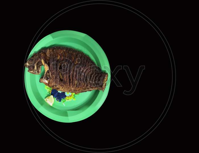 Fish Fry With Plate Isolated On Black Background