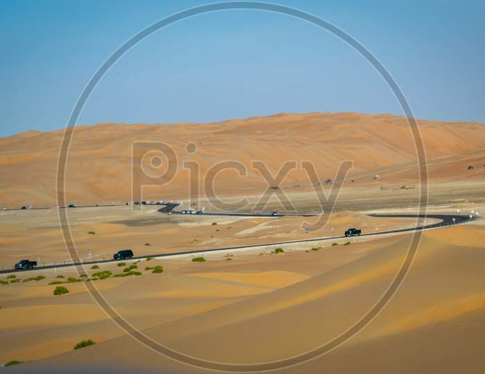 A Beautiful View Of Reoad Crossing Through Clean Sand Dune From Liwa Desert Abu Dhabi