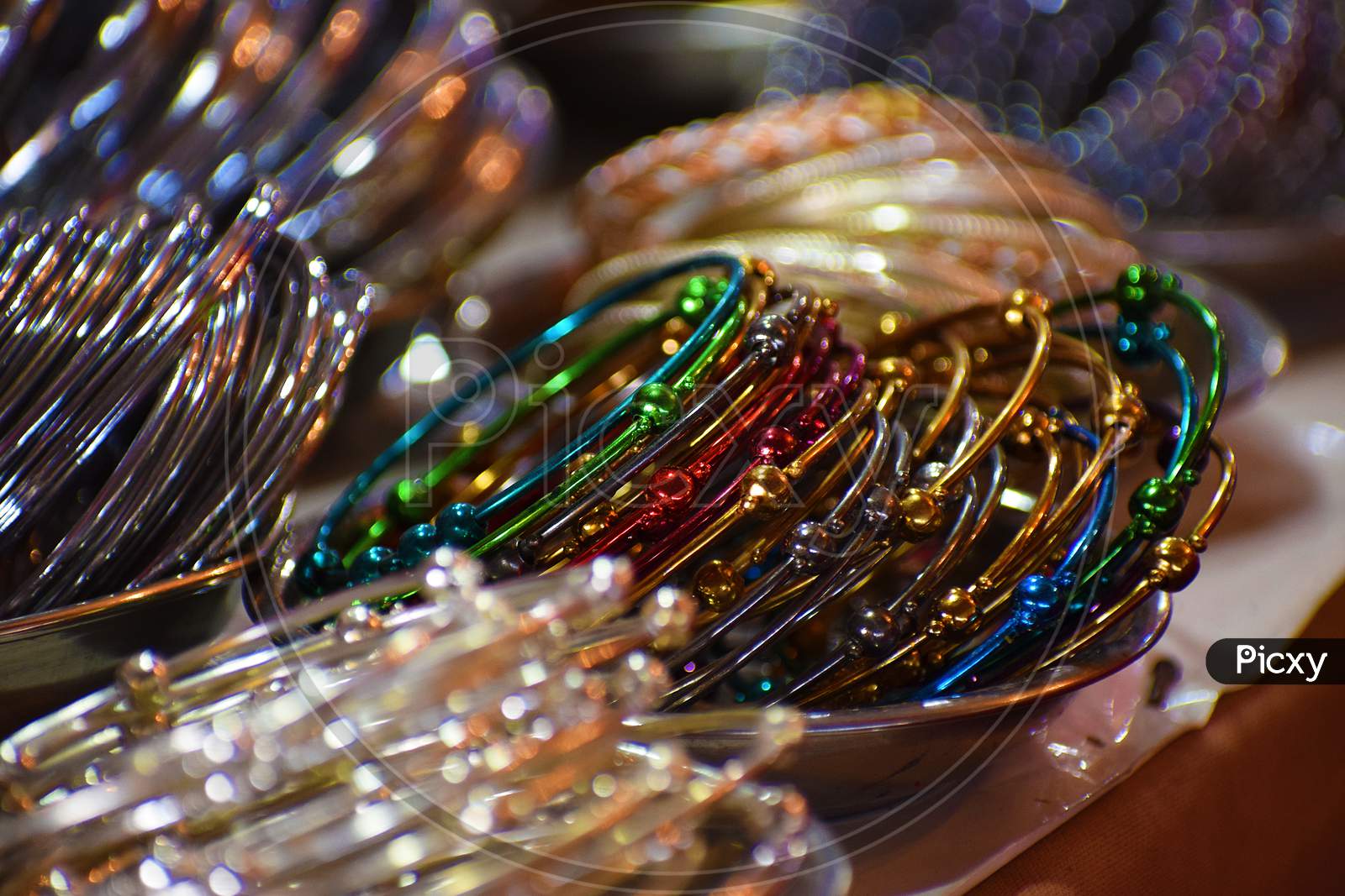 Colourful bangles from a shop in bilaspur, chhattisgarh, India. These bangles are made of metal used as beauty accessories.
