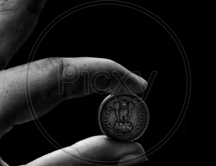 Black and white portrait of a coin