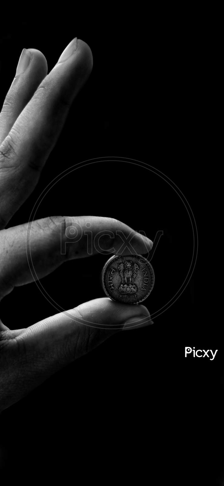 Black and white portrait of a coin