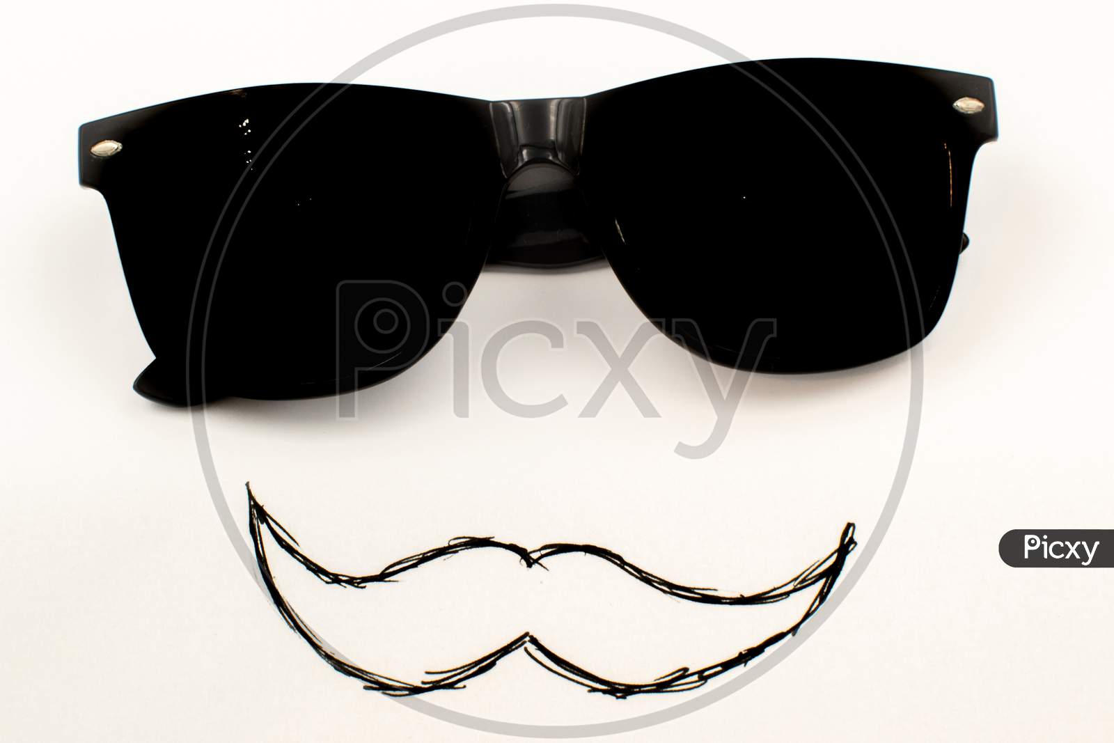 Black Sunglasses With A Hand Drawn Moustache Isolated On A White Background
