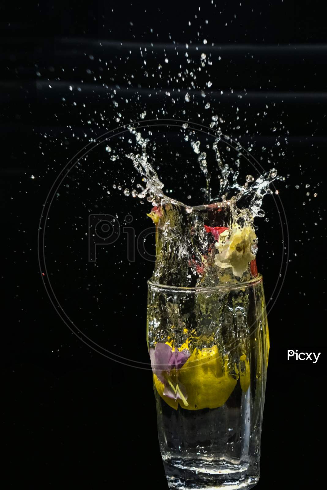 Beautiful Closeup Photograph Of Water Splash With Black Background,