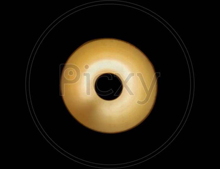 A Round Shaped Yellow Colored Led Light With Black Background.