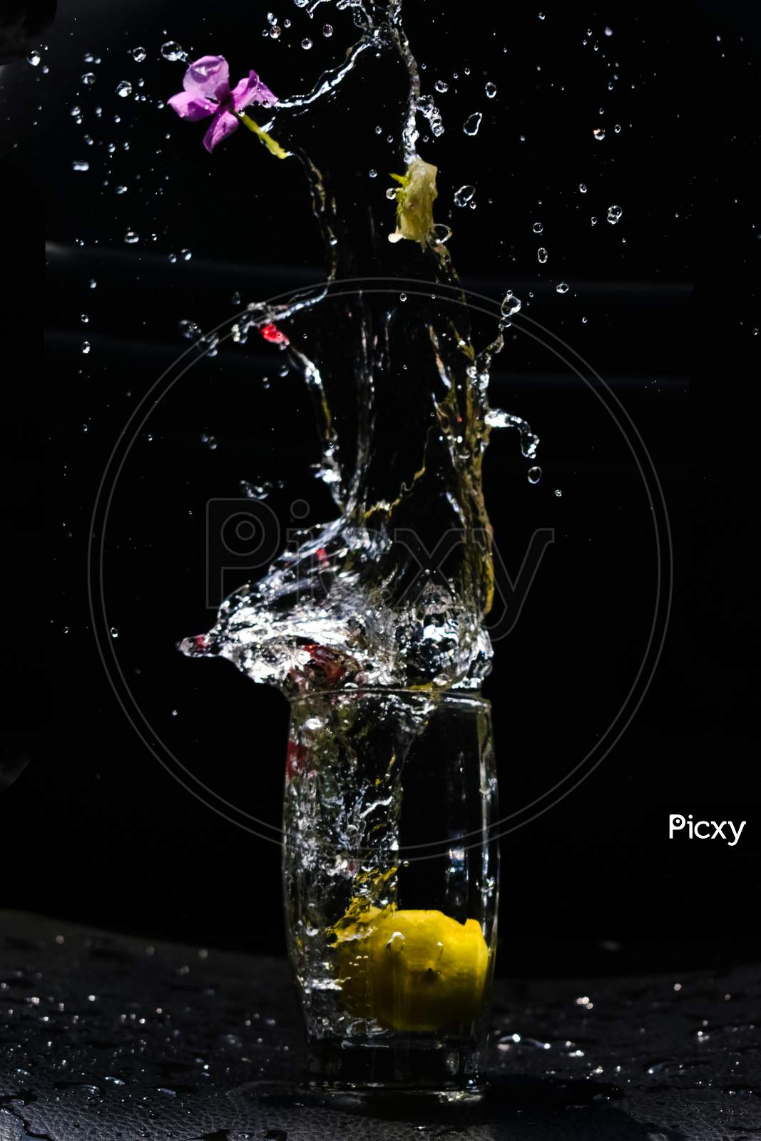 Beautiful Closeup Photograph Of Water Splash With Black Background,