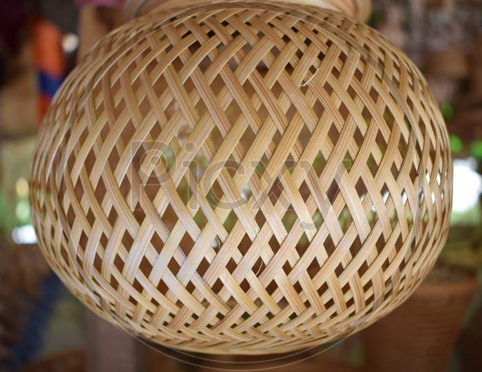 Beautiful light bulb holder woven with bamboo strips.