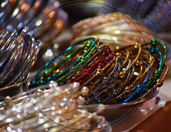 Colourful bangles from a shop in bilaspur, chhattisgarh, India. These bangles are made of metal used as beauty accessories.