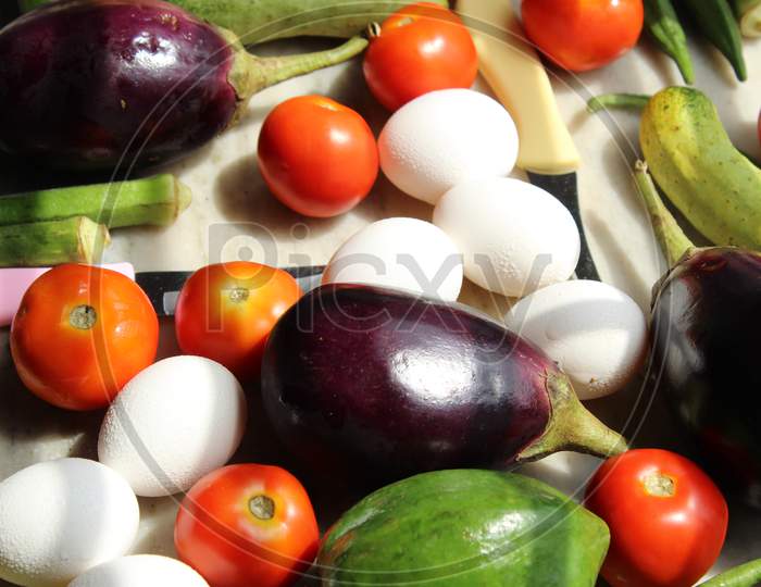 Eggs and fresh various raw organic vegetables display with selective focus