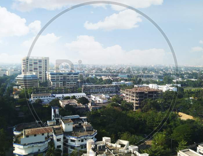Sky view of a city area with random buildings from top