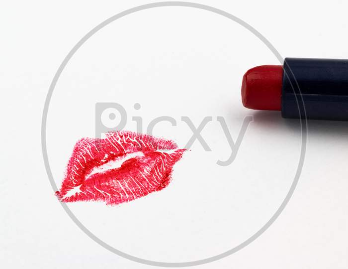 Red Lipstick Mark And Lipstick Isolated On A White Background