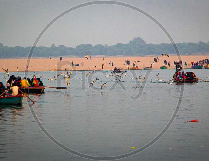 People Enjoying Boating In Ganga River