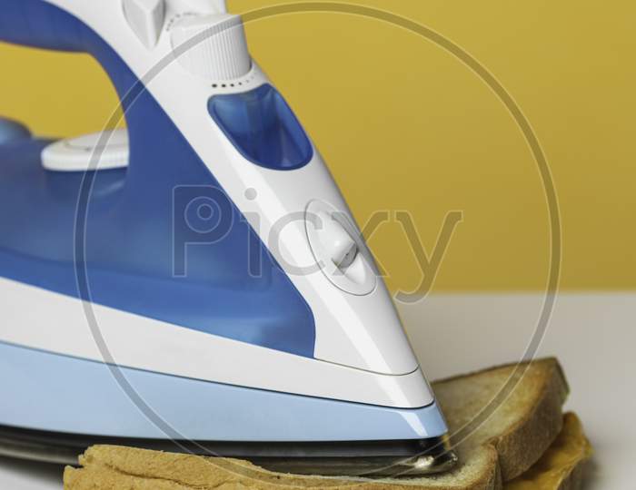 White And Blue Steam Iron