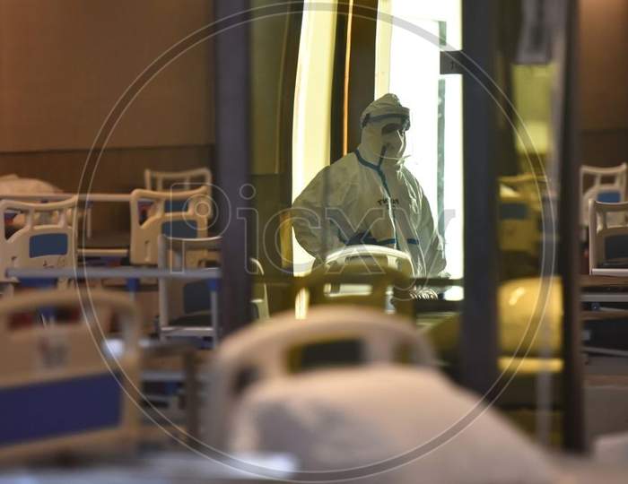 New Delhi, India - July 13: A Health Worker In Ppe Kit On Duty At The Temprary Covid Care Facility, At Shehnai Banquet, On July 13 In New Delhi, India