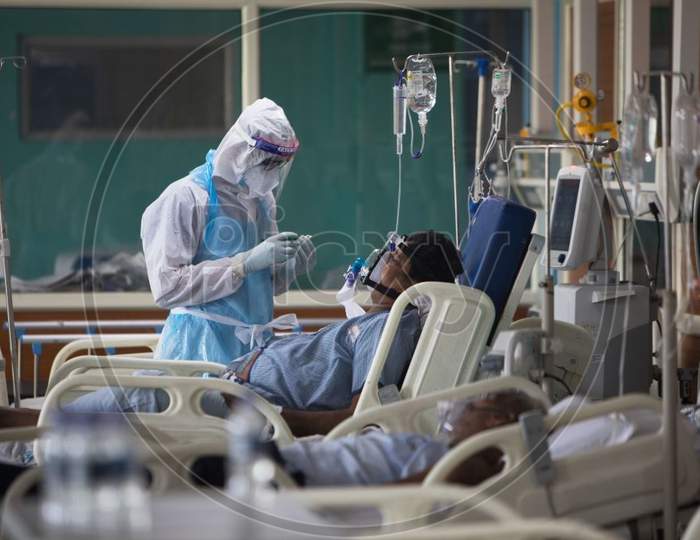 A Medical Staff Wearing Personal Protective Equipment (Ppe) Suit Looks After A Covid-19 Coronavirus Patient At The Intensive Care Unit Of The Sharda Hospital, In Greater Noida On July 15, 2020