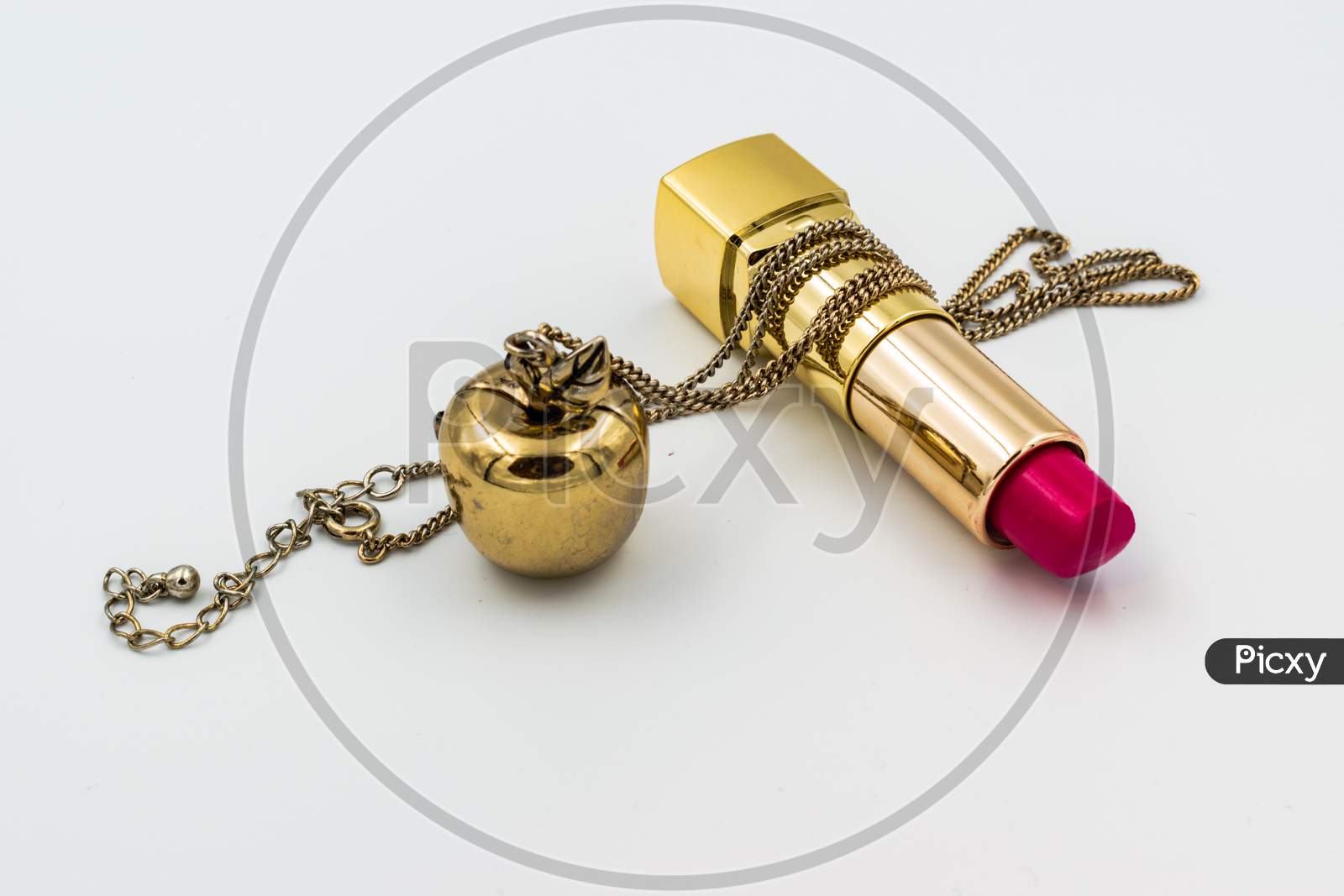 Pink Lipstick With A Golden Necklace Isolated On White Background