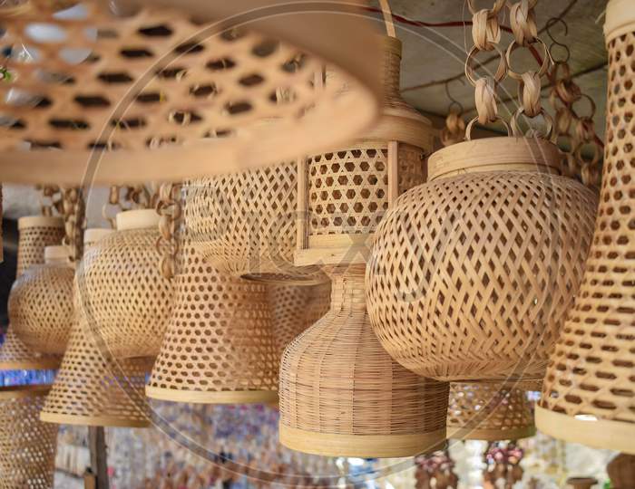 Handicraft light bulb holders. This holder made with bamboo strips.