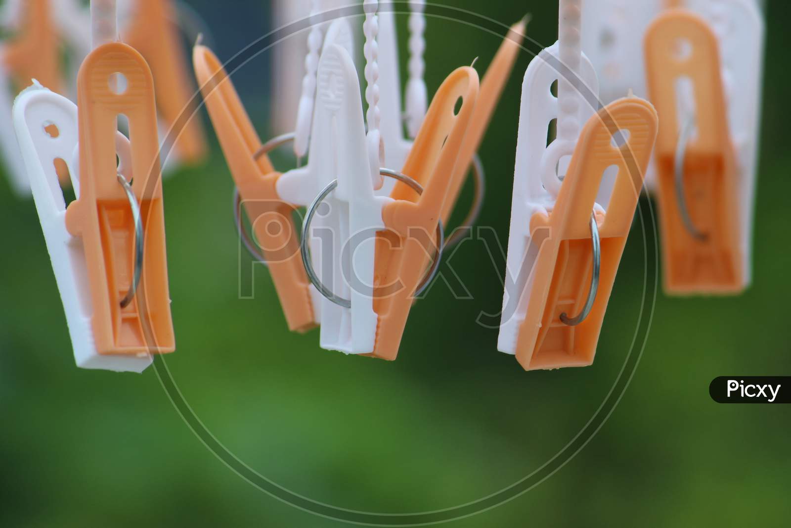 Group of colorful cloth clips used for hanging cloths display.