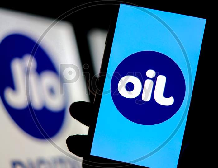 Jio Logo as Flipped Jio Logo as OIL on a Smartphone Screen with Jio Logo in the Background