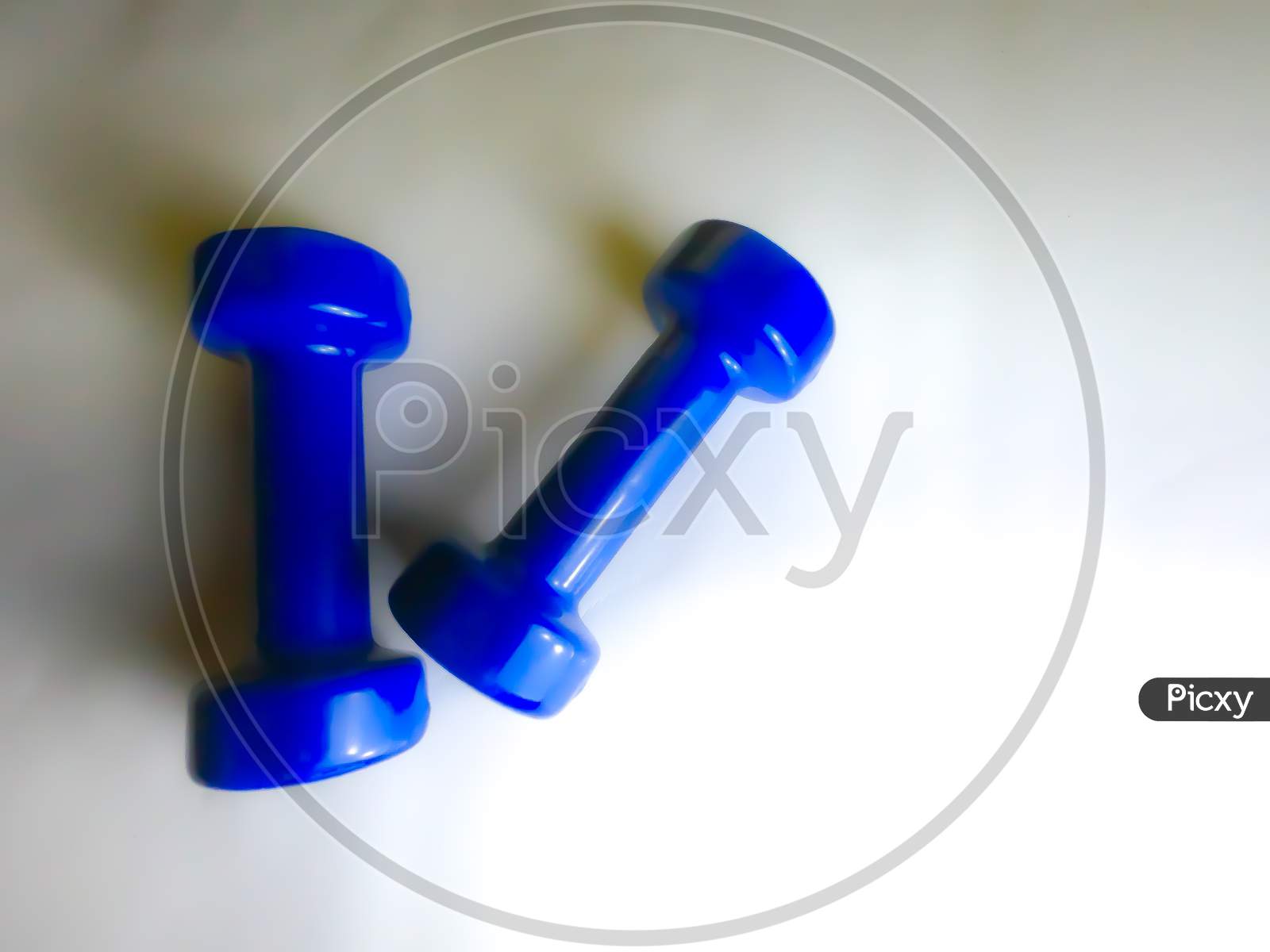 Blue Dumbels with White Background.