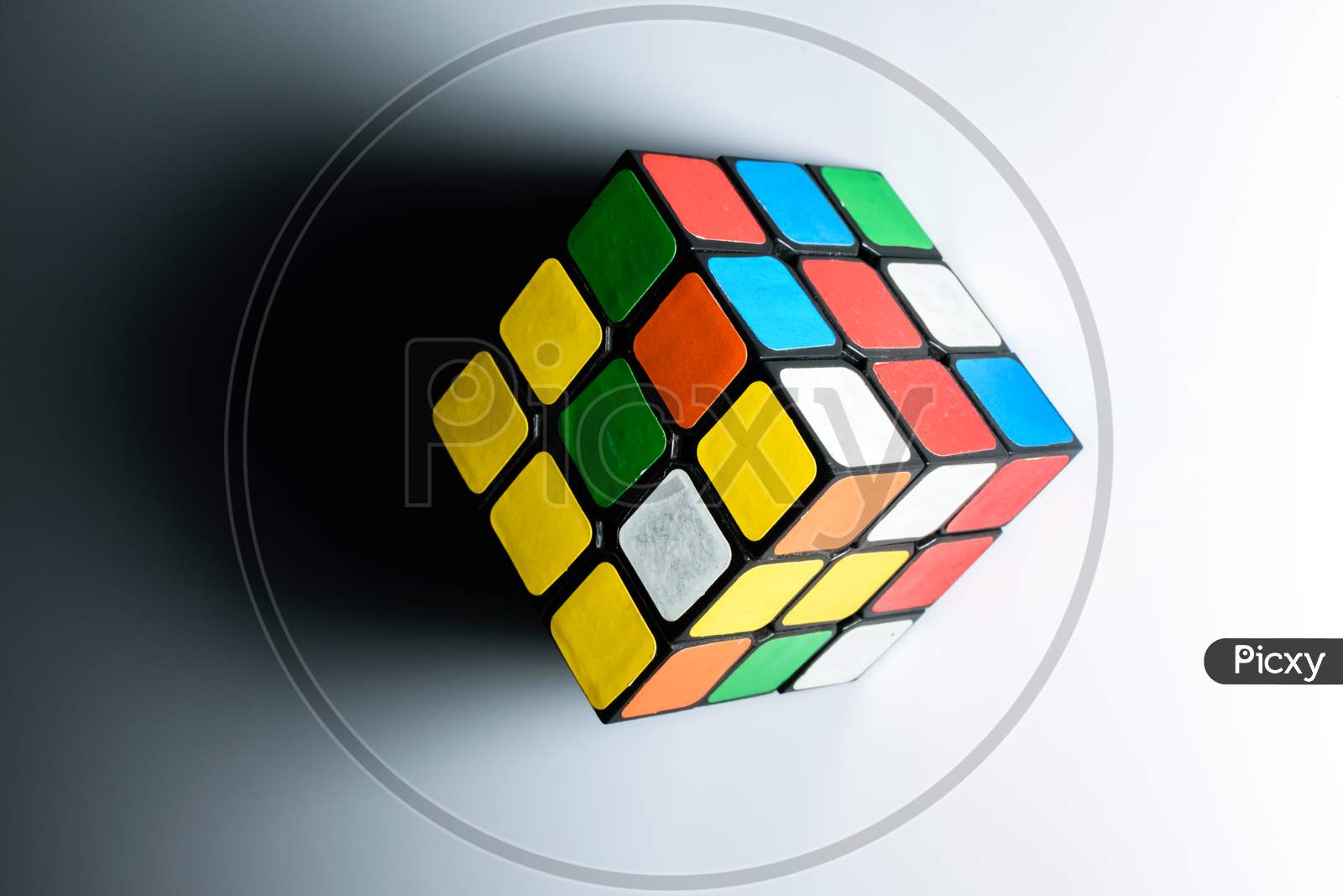 Isolated Rubik'S Cube With Its Shadow. White Background