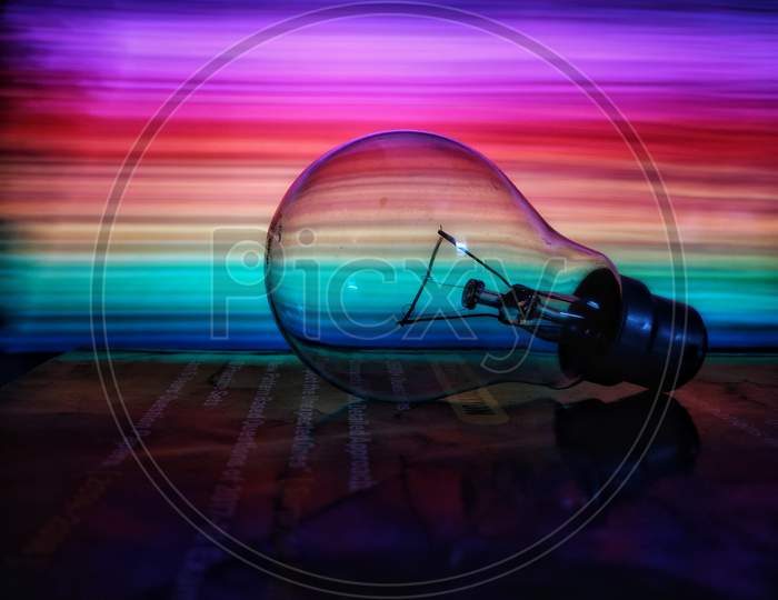 Lightning bulb with colorful background