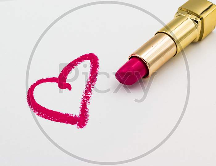 Pink Heart Sign Drawn Eith A Lipstick Isolated On White Background