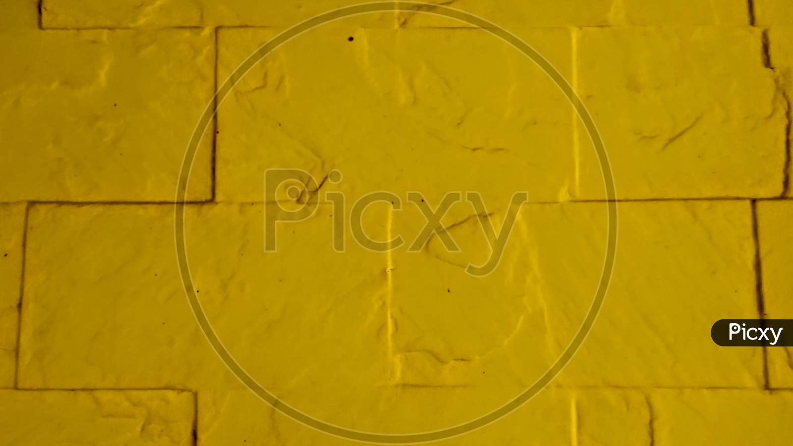 Yellow Painted Brick wall. Old Brick Wall