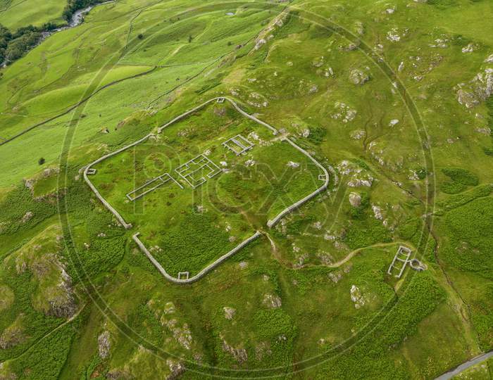 Aerial Of Hardknott Roman Fort Is An Archeological Site, The Remains Of The Roman Fort Mediobogdum, Located On The Western Side Of The Hardknott Pass In The English County Of Cumbria