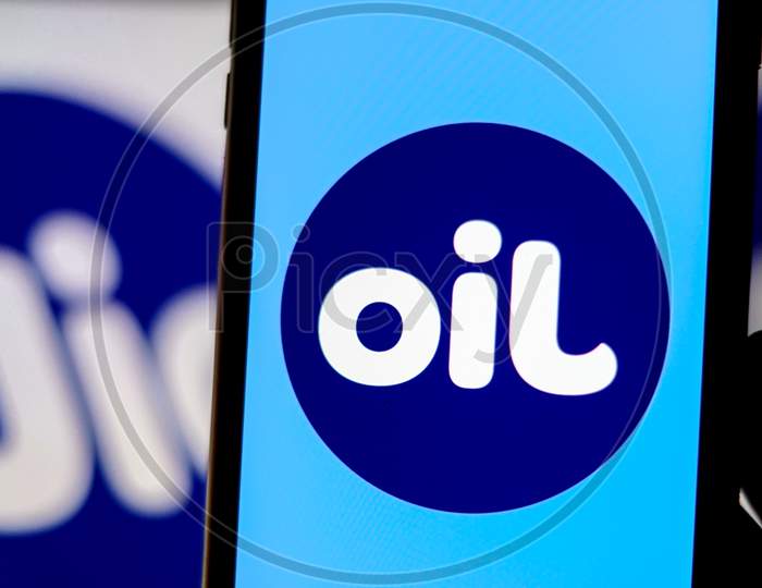 Flipped Jio Logo as OIL in a Smartphone with Jio Logo in the Background