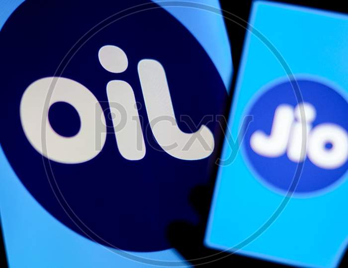 Jio Logo on a Smartphone Screen with Flipped Jio Logo as OIL in the Background